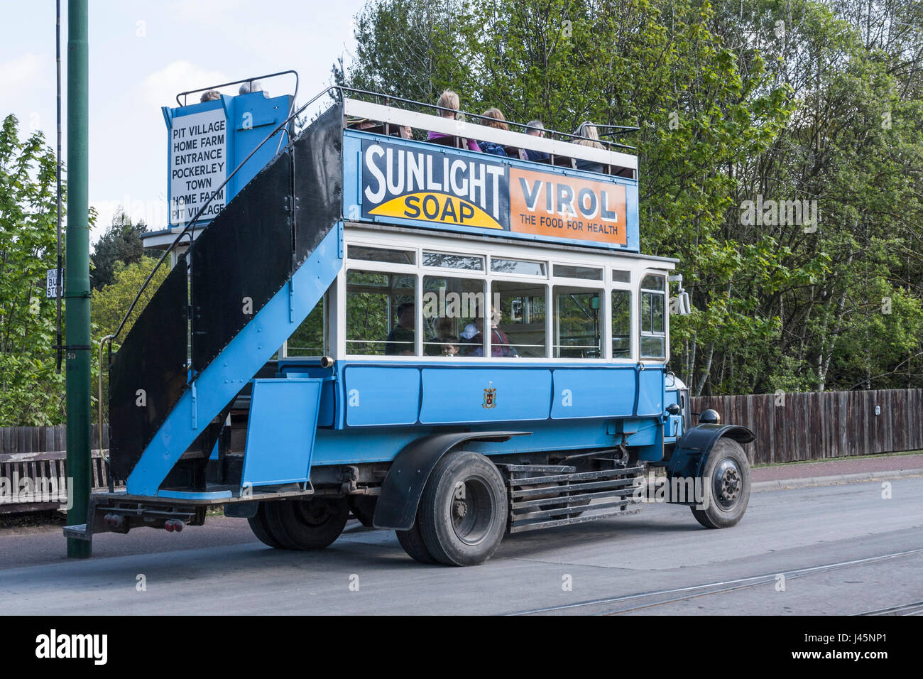 An old fashioned blue bus collecting passengers at Beamish Museum,England,UK Stock Photo