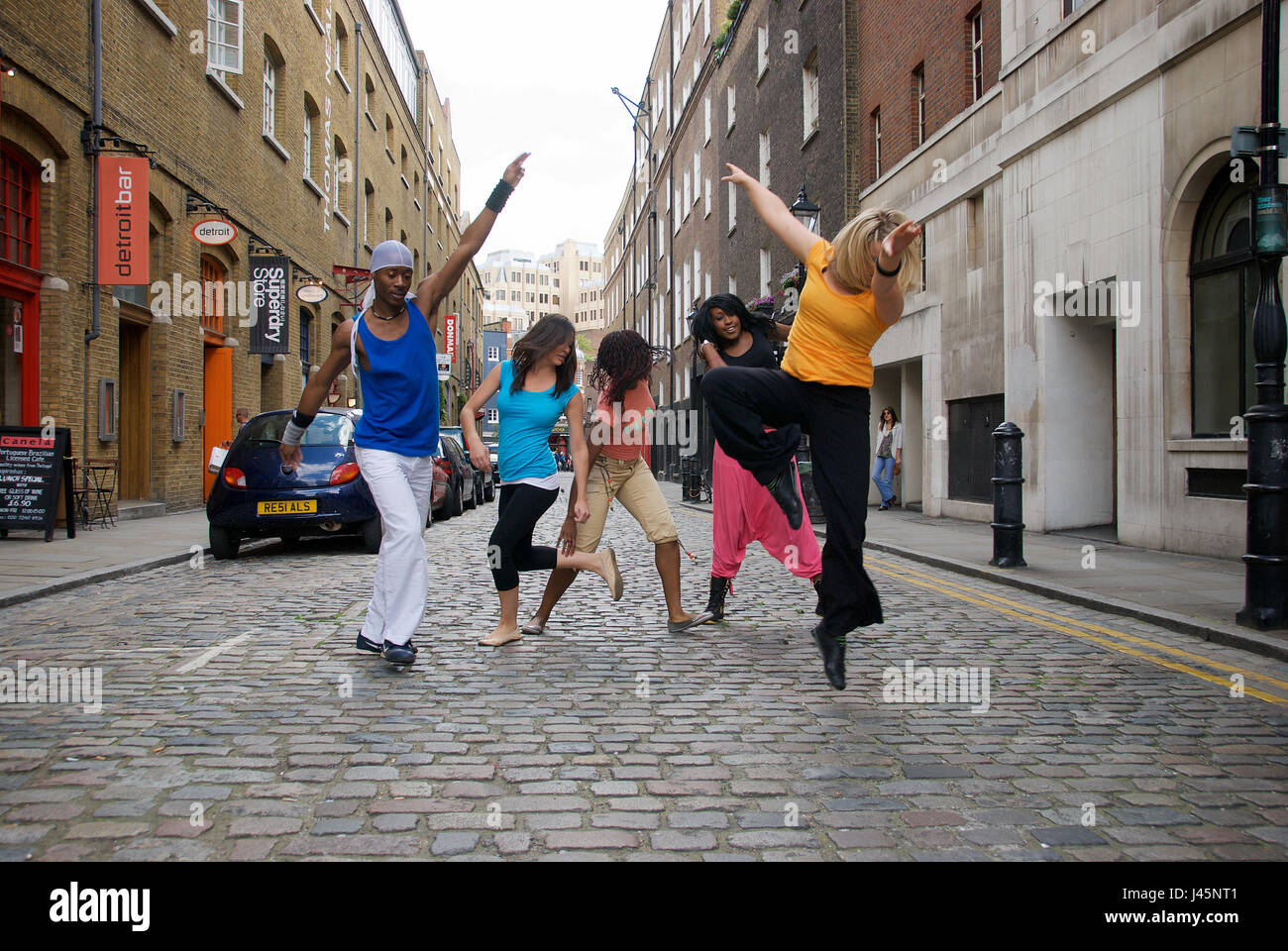 Group of dancers performing on Earlham Street, outside The Cambridge