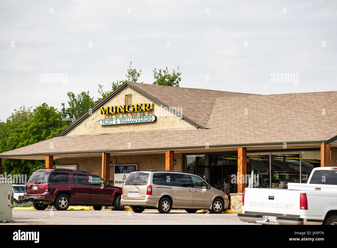 Exterior storefront and entrance of Munger Paint & Wallcovering shop located on North McArthur, Oklahoma City, Oklahoma, USA. Stock Photo