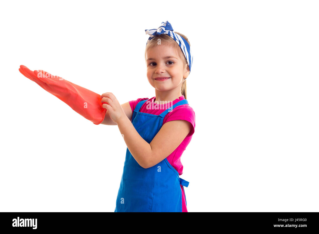 Girl in apron and gloves Stock Photo - Alamy