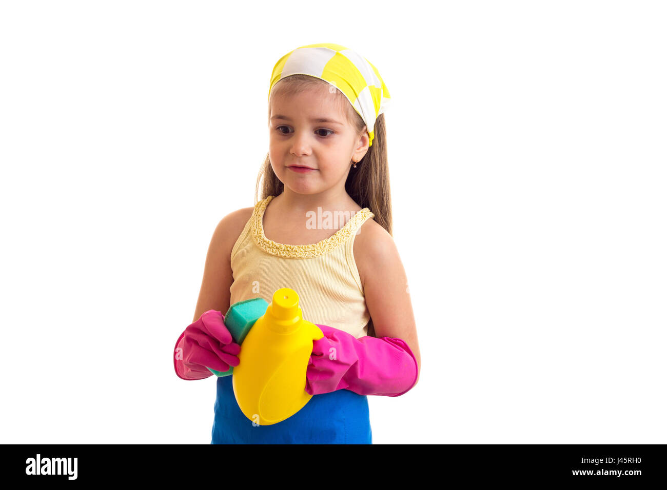 Girl in apron with bottle and sponge Stock Photo Alamy