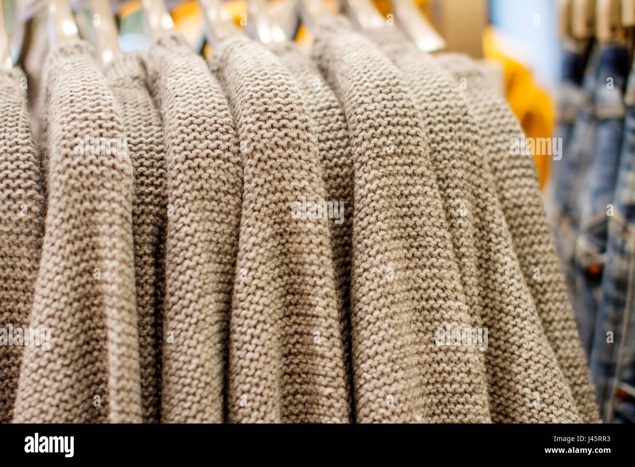 a ool sweater on a hanger in the storec Stock Photo