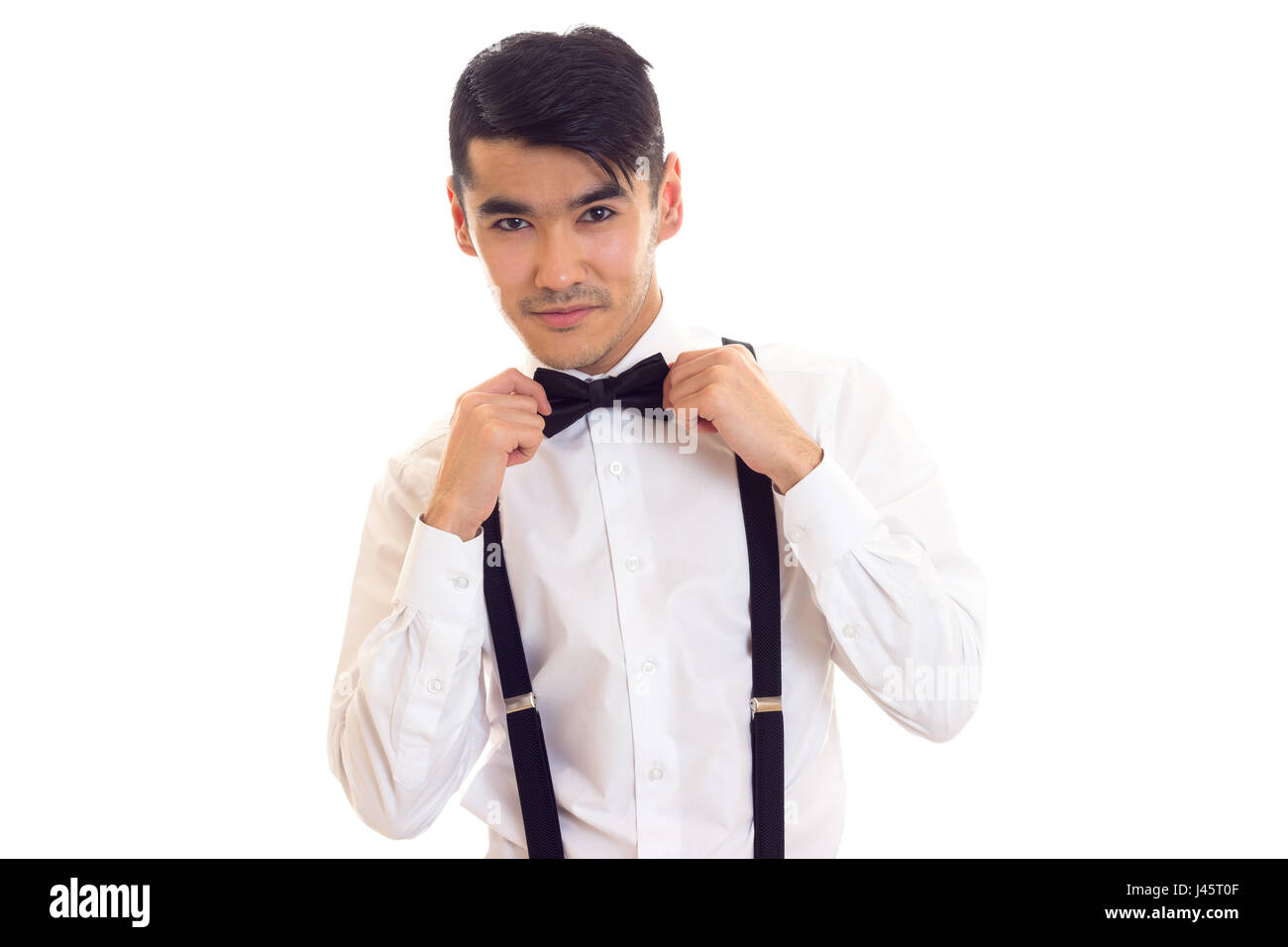 Young man with bow-tie and suspenders Stock Photo - Alamy