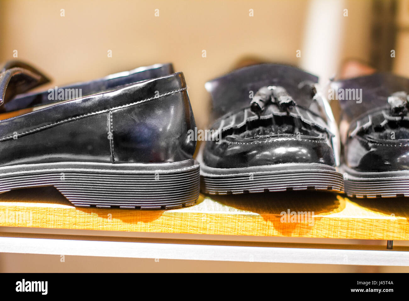 image black man's shoes stand on a shelf in the store Stock Photo