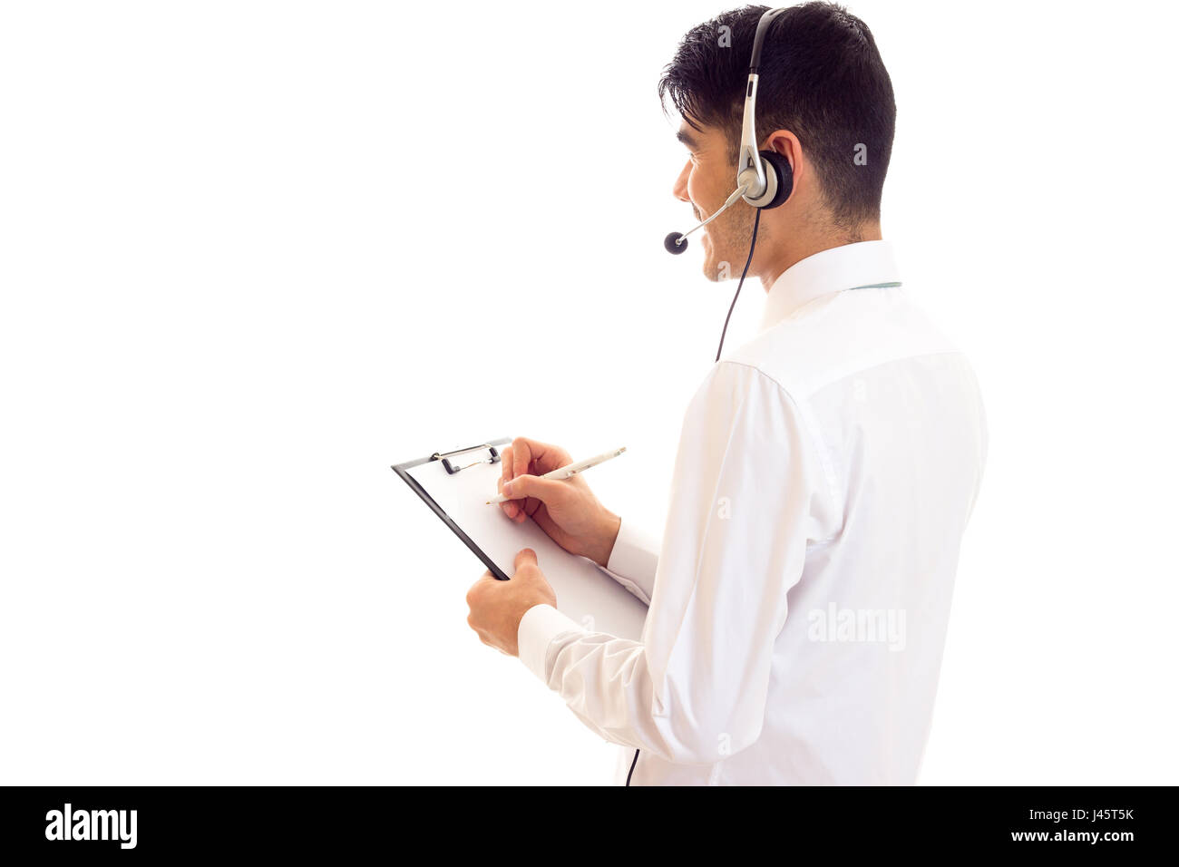 Young man in headphones holding a folder  Stock Photo