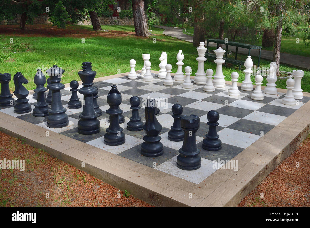 Large chess set outdoors on lawn Stock Photo Alamy
