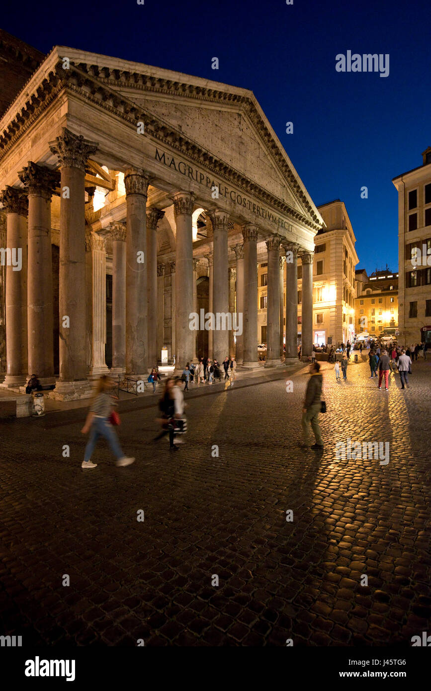 An exterior view of tourists visitors outside the Pantheon in Rome at night, evening, dusk. Stock Photo