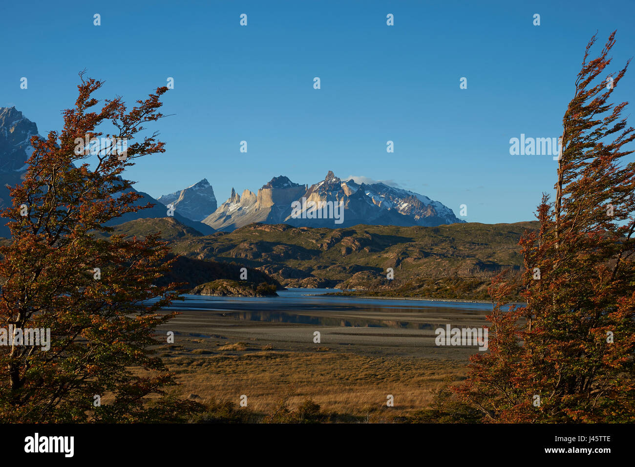 Mountain peaks of Cuernos del Paine rising above the southern end of Lago Grey in Torres del Paine National Park in Patagonia, Chile. Stock Photo