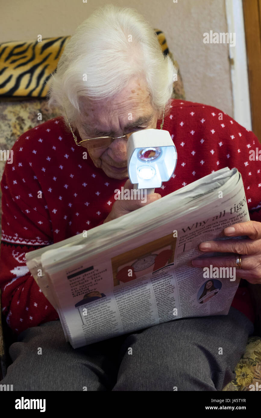 Elderly woman suffering from macular degeneration Stock Photo