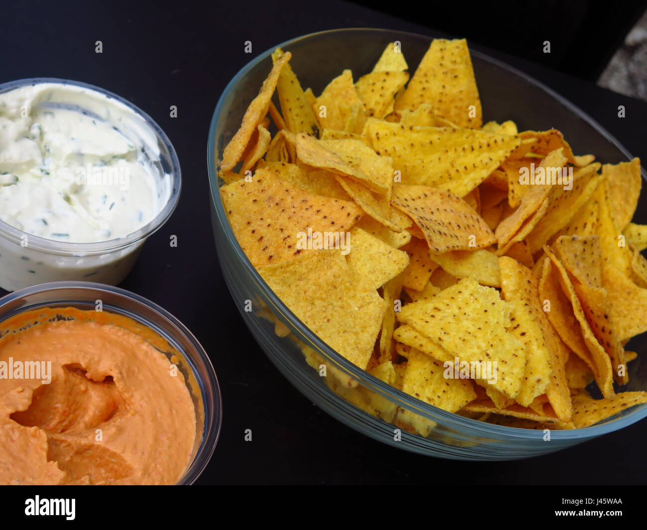 Nacho chips with dips Stock Photo Alamy