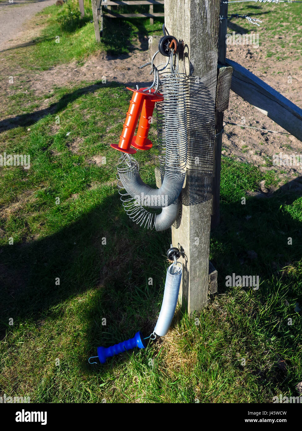 Plastic handles for electric fence gate Stock Photo Alamy