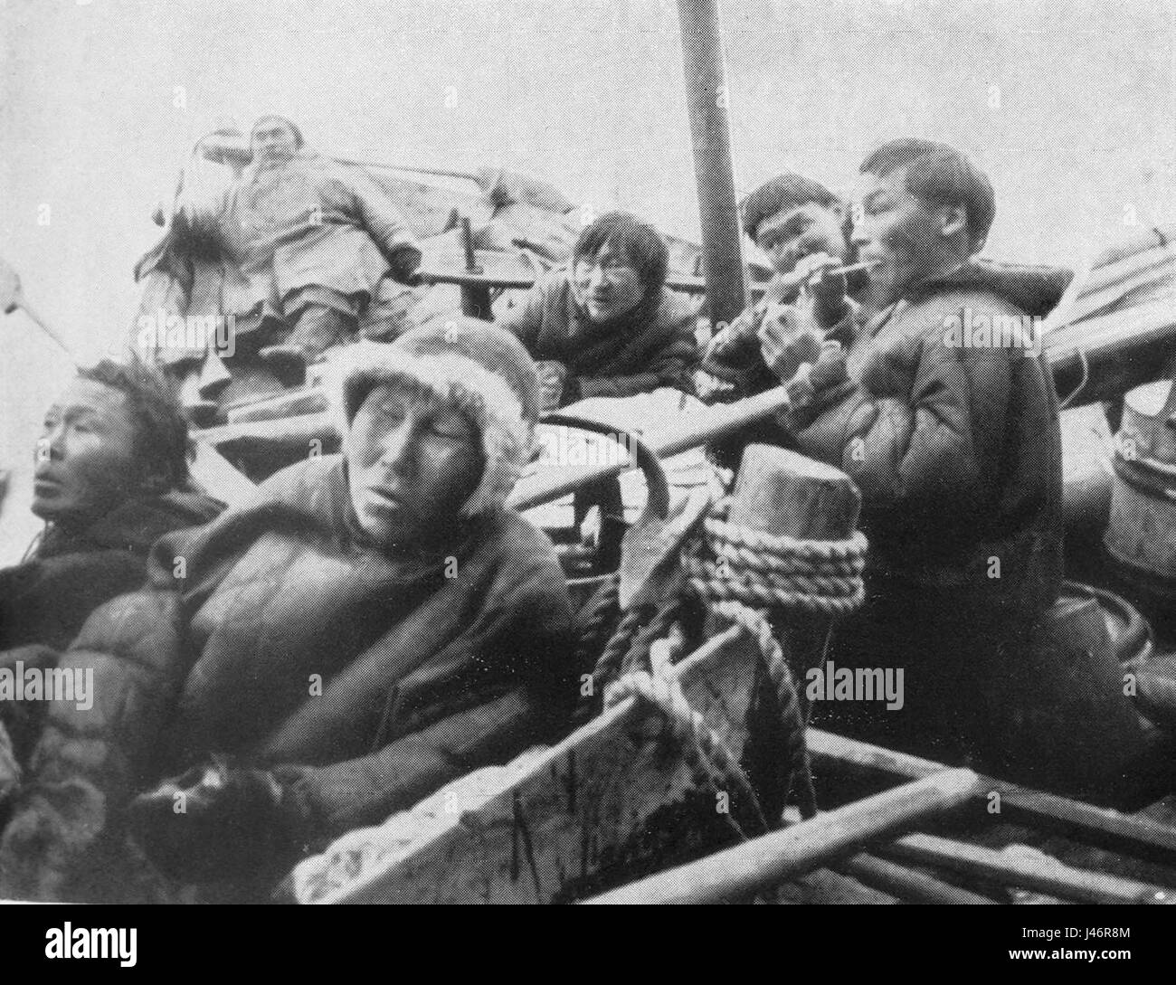 P59b Samoyedes in their boats. Those to the right are eating raw fish Stock Photo