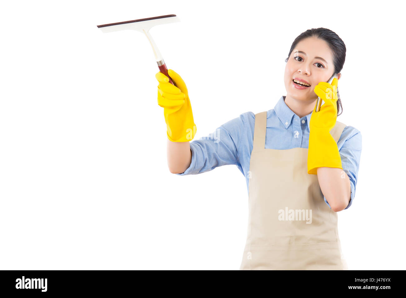 beautiful girl wipe glass by holding a wiper and call for professional house cleaning services. isolated on white background. mixed race asian chinese Stock Photo