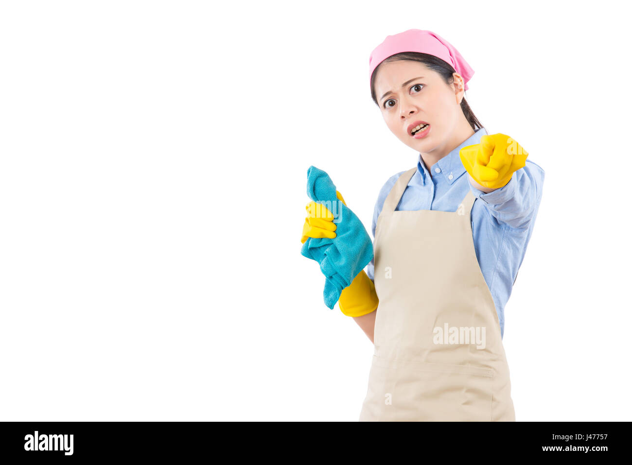 disappointed unhappy housewife criticize your mistake by pointing with yellow gloves finger. isolated on white background. housework and household hea Stock Photo