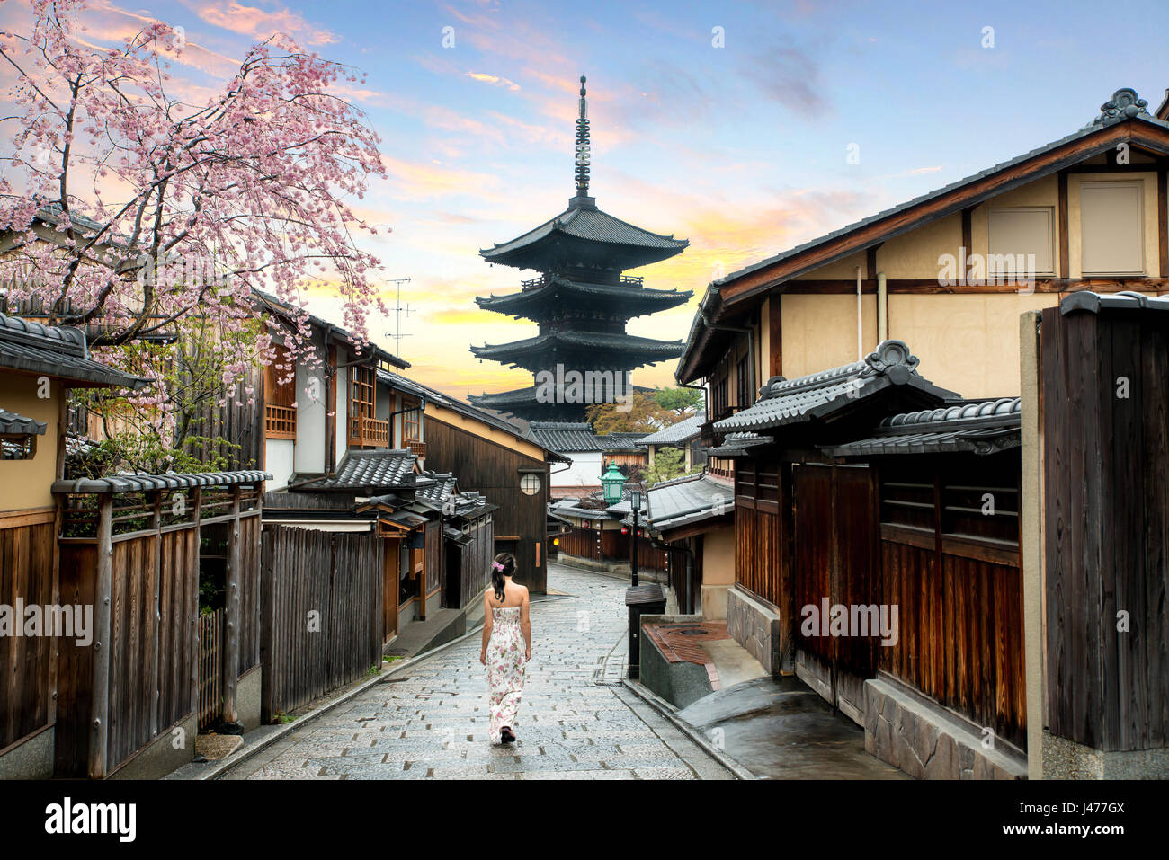 Asian woman walking Yasaka in street near Pagoda in the Morning, Kyoto, Japan Stock Photo