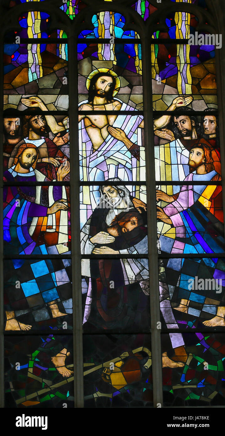 Stained Glass window in the Church of Saint Andrew in Antwerp, Belgium, depicting Jesus and the Parable of the Prodigal Son Stock Photo