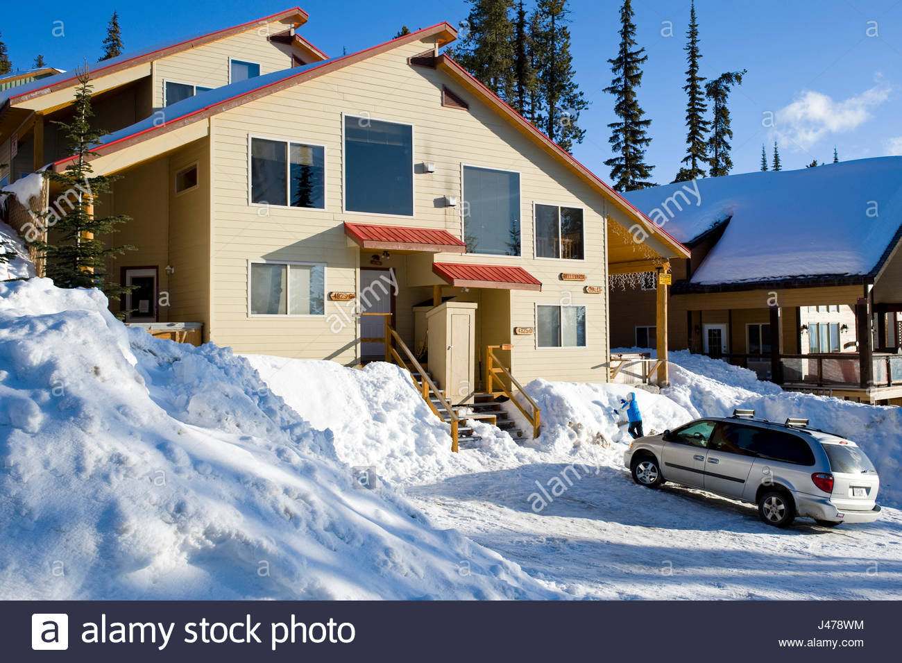Snow covered homes along lower snow pines road big white british columbia canada