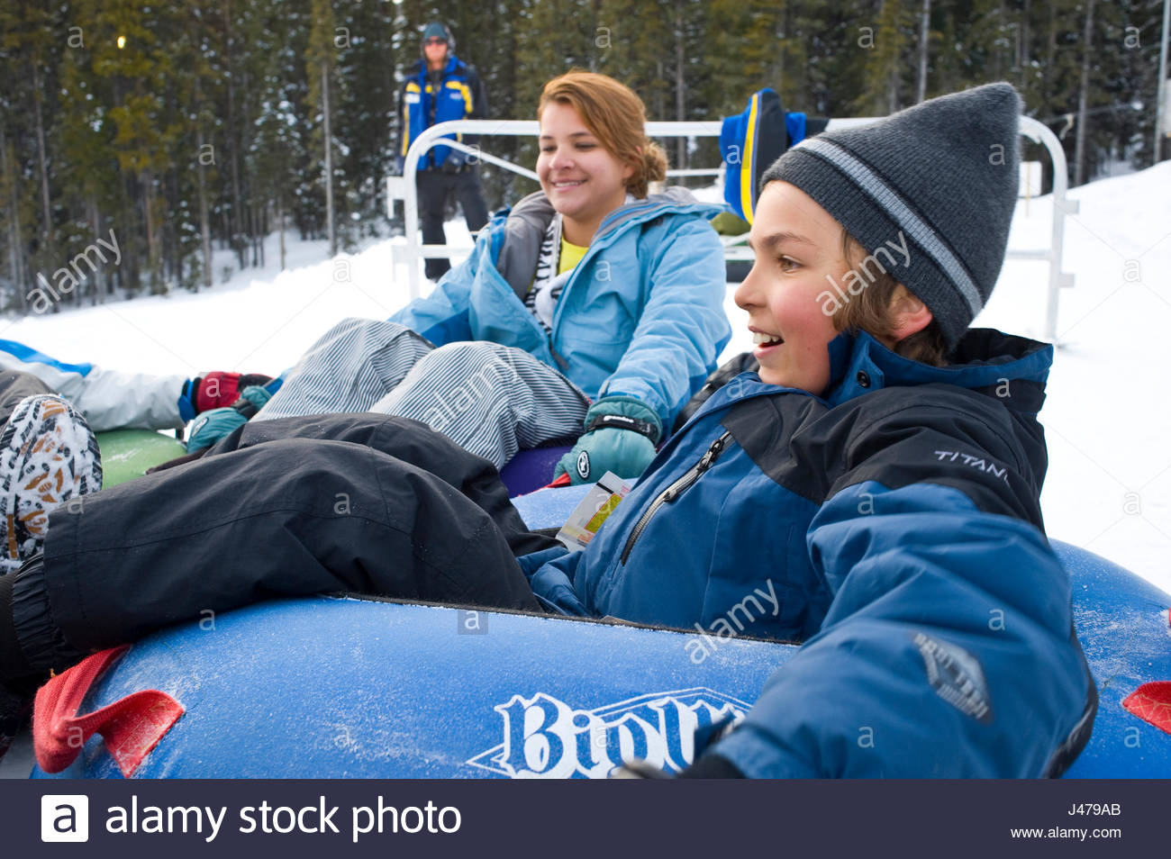Sister And Brother Holding Onto Each Others Tubes At The Top Of The Mega Snowcoaster Happy Valley Big White British Columbia Canada Sister And Brother Holding Onto Each Others Tubes At The Top Of The Mega Snowcoaster Happy Valley Big White British Columbia Canada