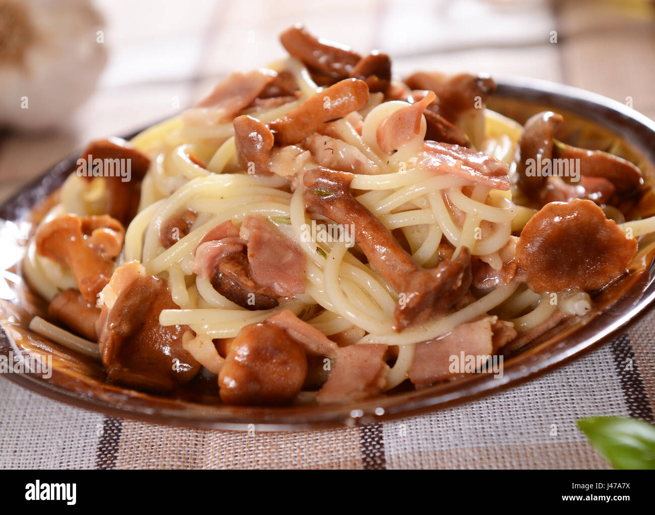 Spaghetti pasta with chanterelles and ham Stock Photo Alamy
