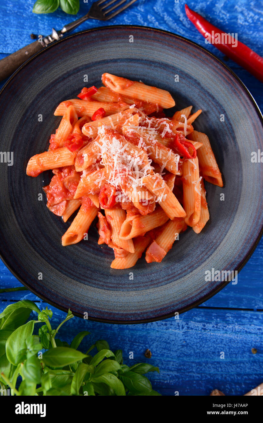 Penne pasta with tomato / arrabiata sauce Stock Photo Alamy