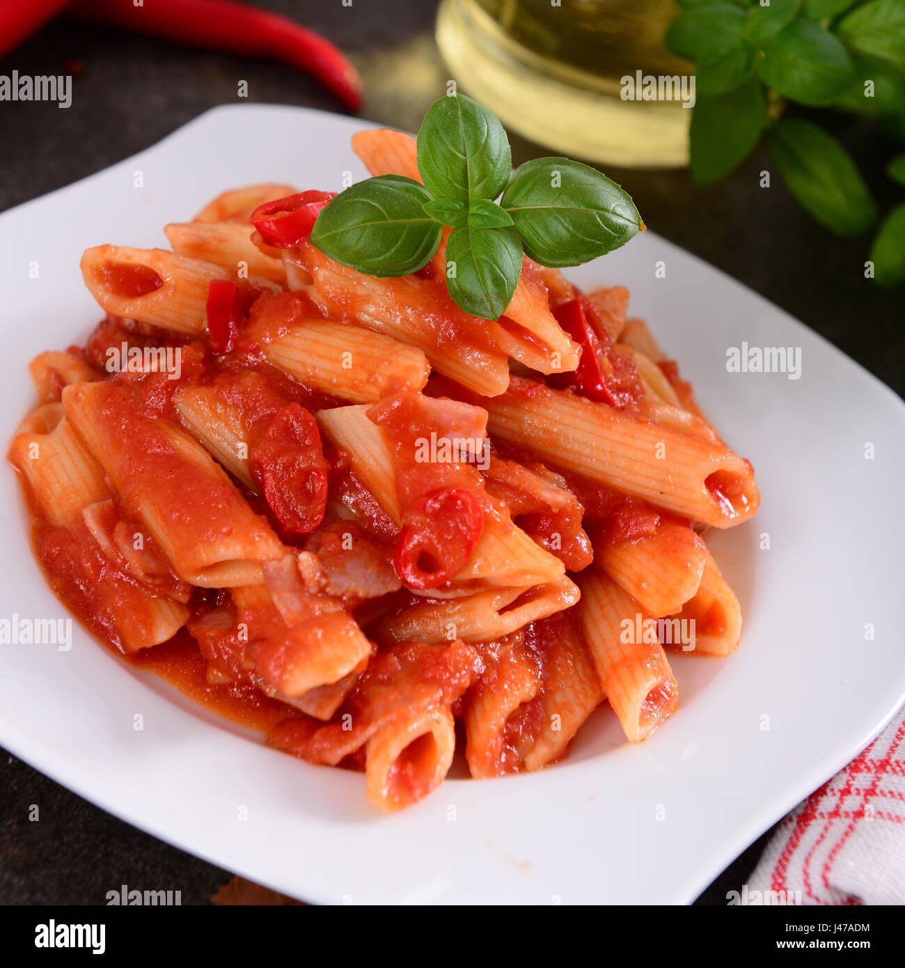 Penne pasta with tomato / arrabiata sauce Stock Photo - Alamy