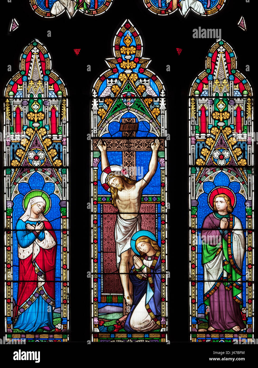 Stained glass window depicting the crucifixion of christ hi-res stock ...