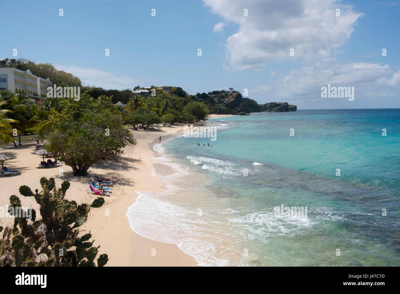 An aerial view of swimmers in the sea at Magazin Beach in Southwestern Grenada, The Caribbean Stock Photo