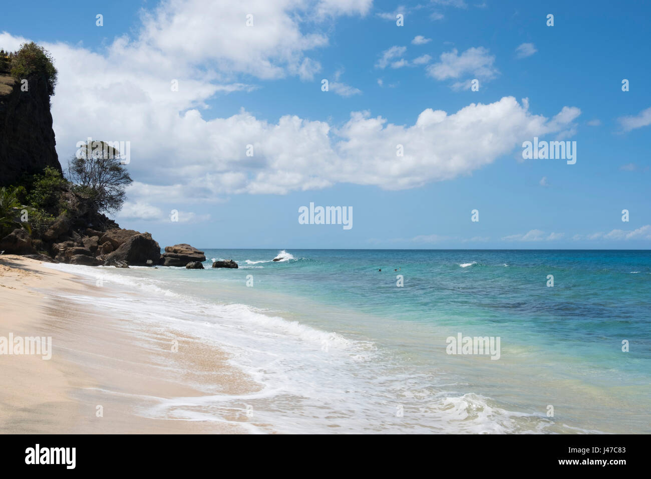 A rocky cliff at the end of Magazin Beach in Southwestern Grenada, West Indies, The Caribbean Stock Photo