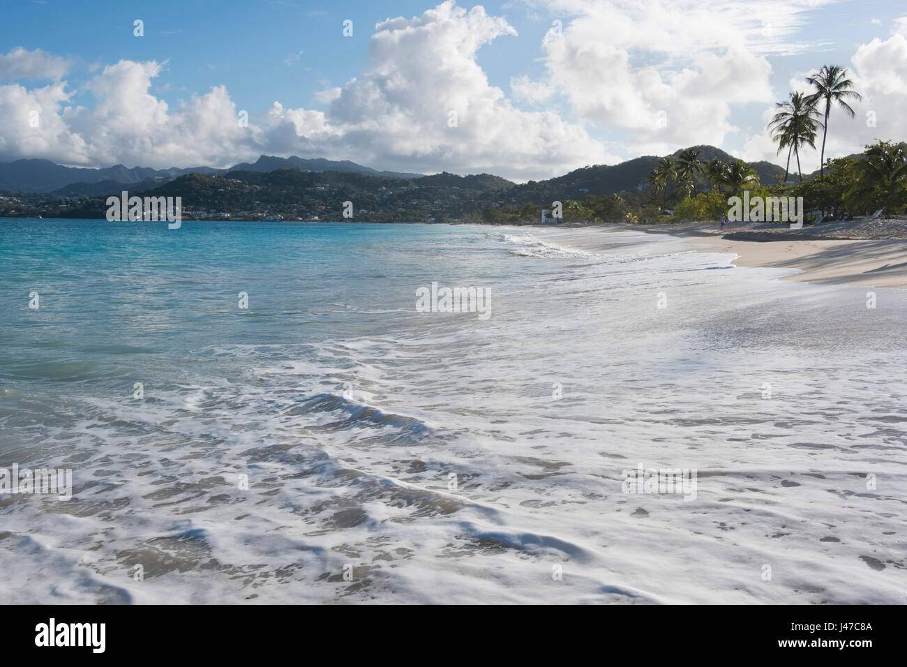 Surf on Grand Anse Beach and the view toward the coast around St. George's, Grenada, West Indies,  The Caribbean. Stock Photo