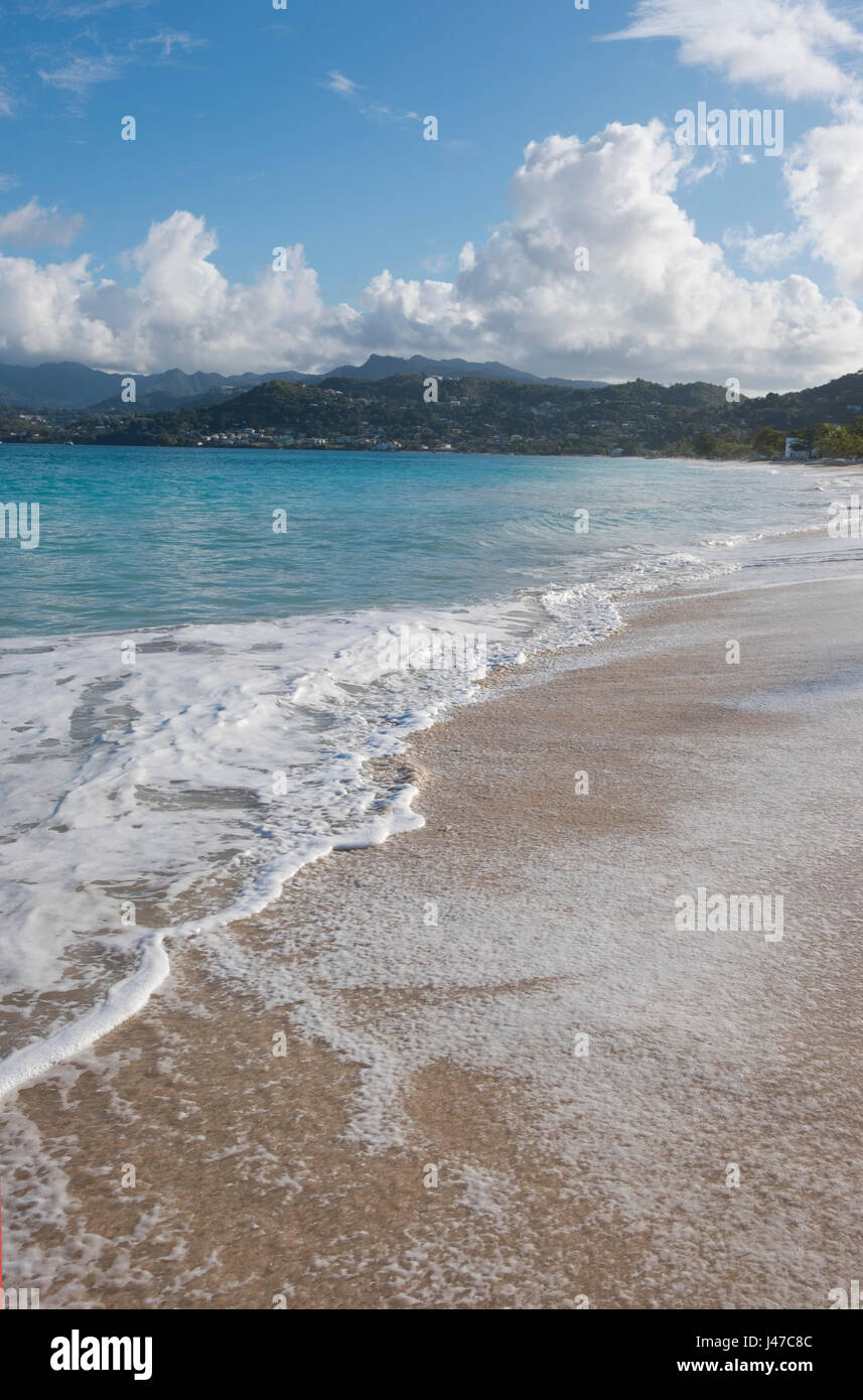 Surf on Grand Anse Beach and the view toward the coast around St. George's, Grenada,  West  Indies, The Caribbean. Stock Photo