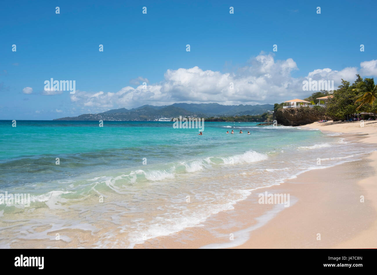 Swimmers in clear blue sea at Magazin Beach in southwest Grenada, West Indies, Caribbean Stock Photo