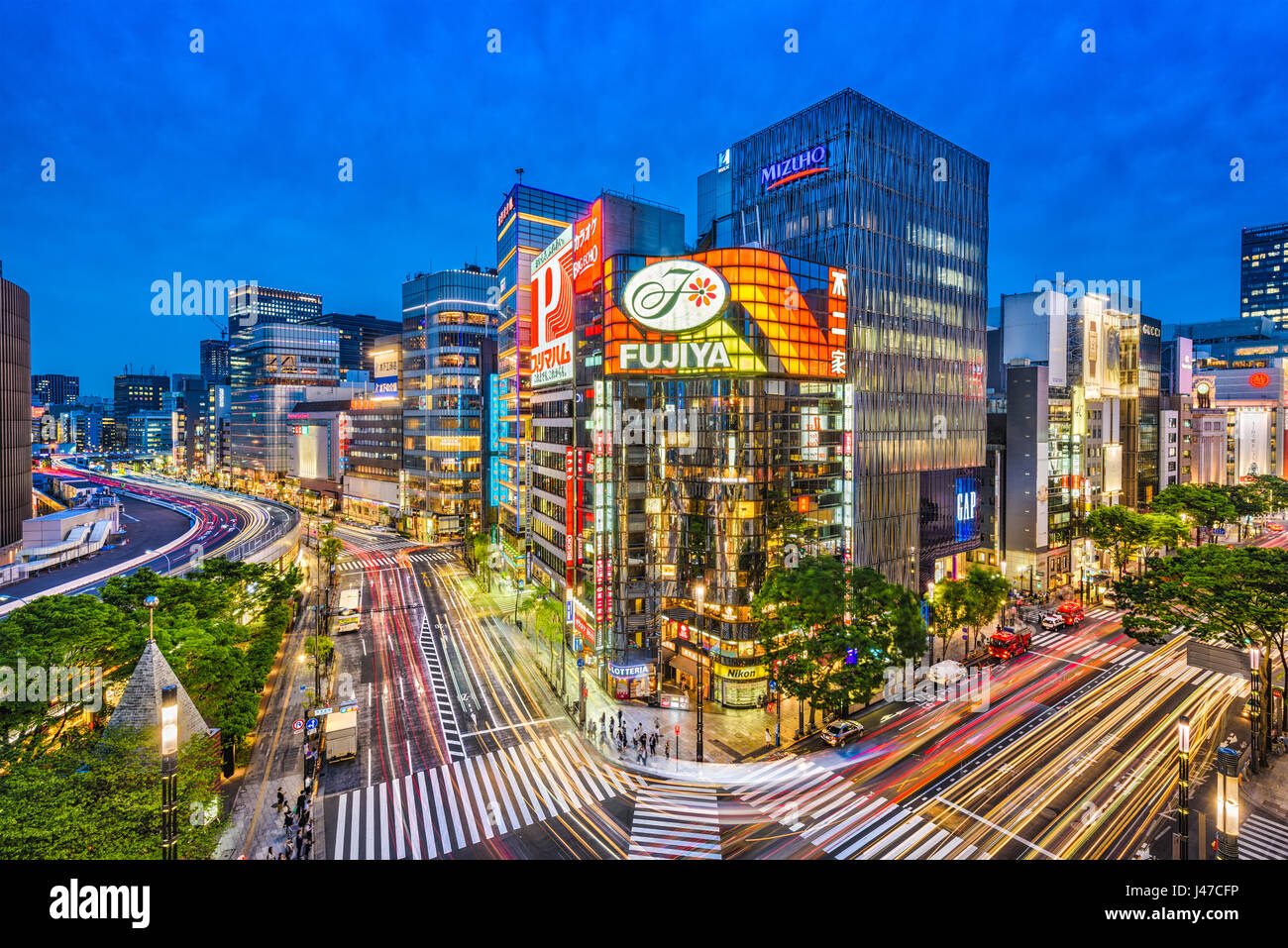 TOKYO, JAPAN - MAY 9, 2017: The Ginza district at night. Ginza is a popular upscale shopping area of Tokyo. Stock Photo