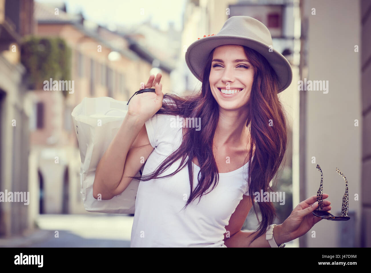Young beautiful woman with shopping bags in the ctiy- Let's go shopping concept Stock Photo