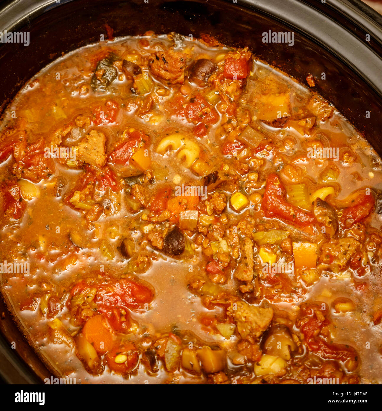 Stewed Meat In Cooking Pot With Ingredients And Kitchen Tools On Dark  Background High-Res Stock Photo - Getty Images