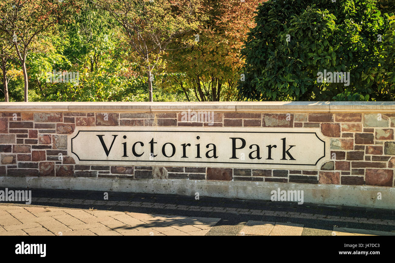 Sign on brick wall entrance to Victoria Park, Kitchener Ontario, Canada Stock Photo