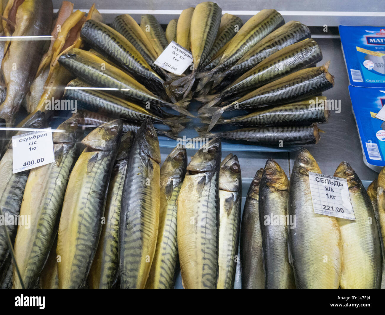 Smoked Herring and Mackerel on a market stall in Kazan Stock Photo