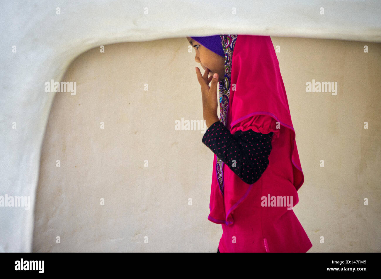 Malay young lady dressing a beautiful Baju Kurung with. Lonely Planet ideal picture. Stock Photo