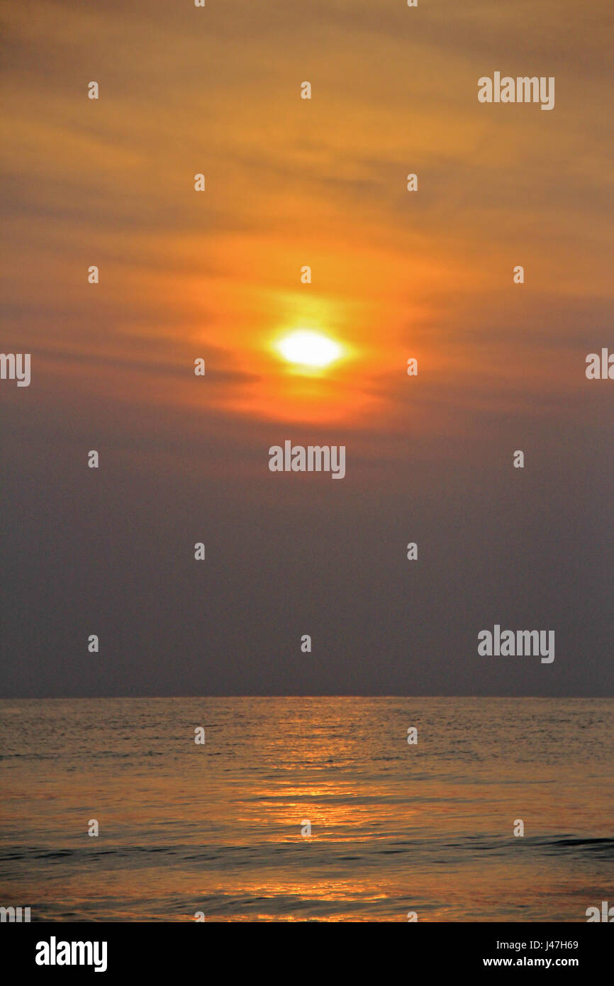 Beautiful tropical sunset beach , silhouette over the sea Stock Photo ...