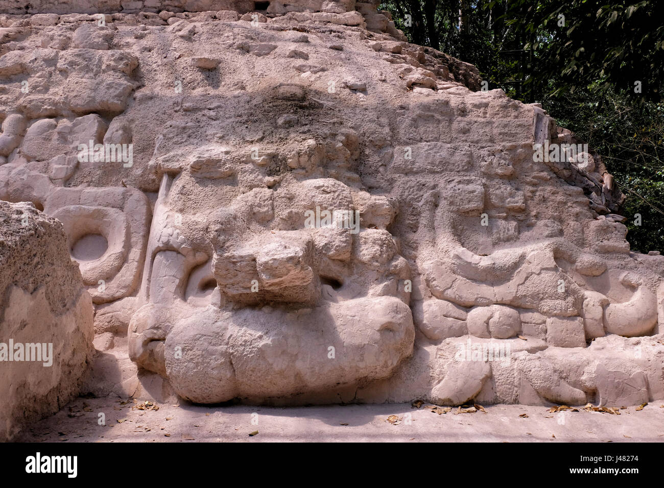 Stone work at structure 34 also called “Templo Garra de Jaguar - Jaguar’s Paw Temple” at El Mirador a large pre-Columbian Maya settlement, located in a remote site deep in the jungle in the north of the modern department of El Peten, Guatemala Stock Photo