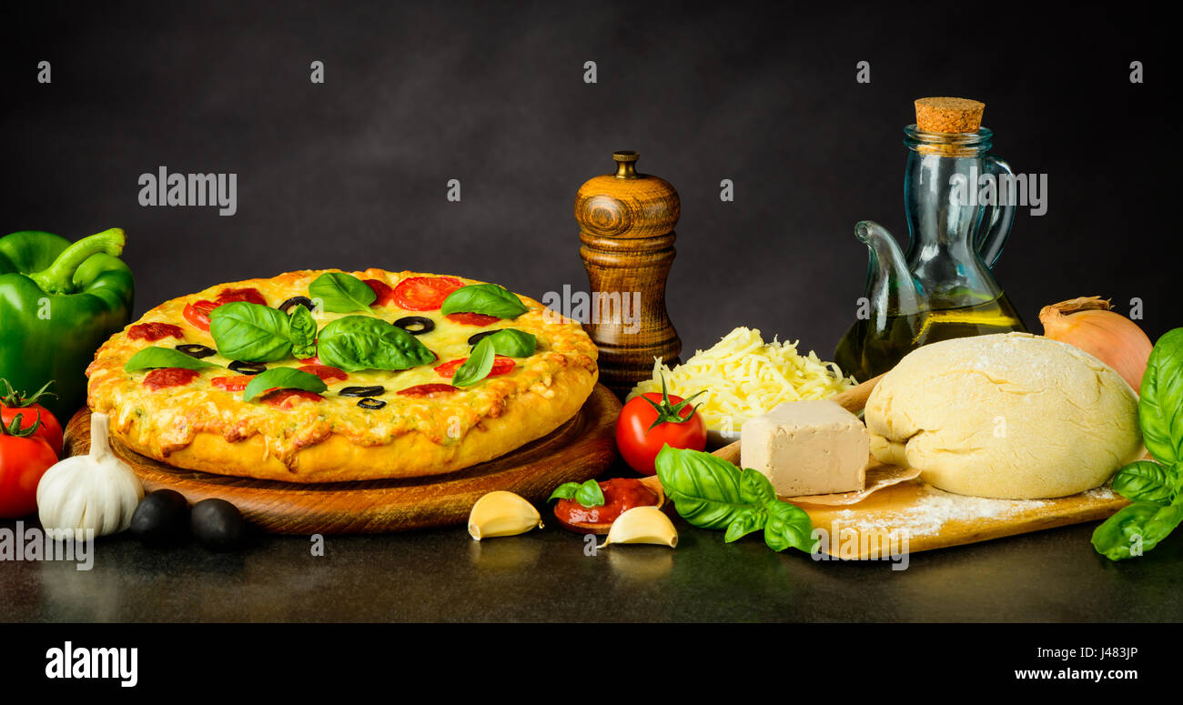 Pizza Margherita with Vegetables, Dough and Cooking Ingredients Stock Photo