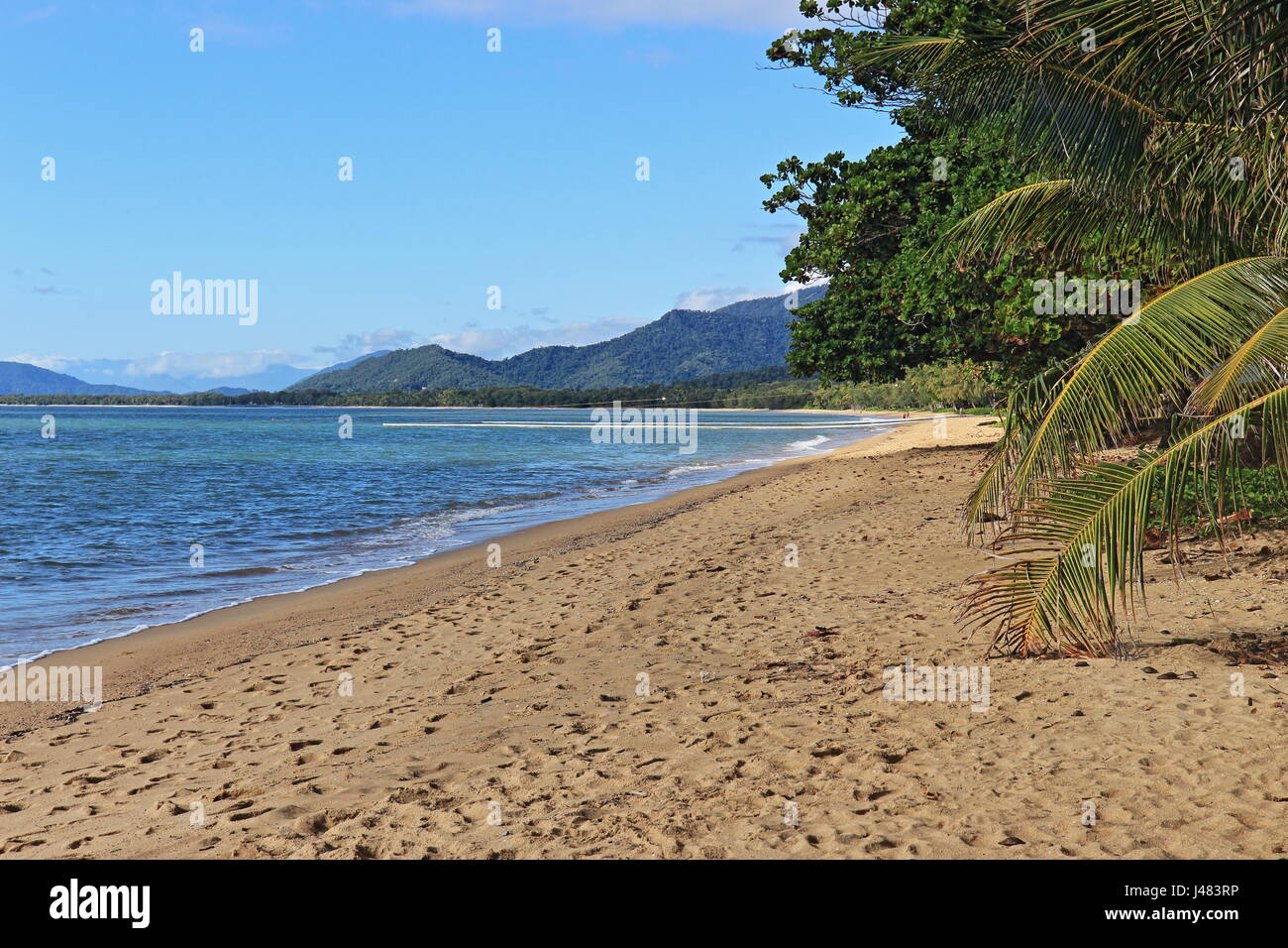 Beautiful, uncrowded Palm Cove Beach view from the top end near the jetty Stock Photo