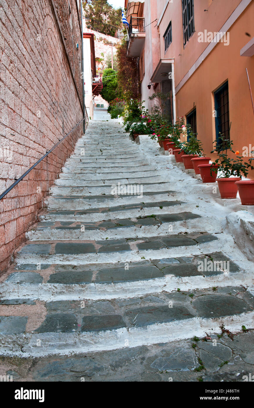 Flower pots and stairs: neighbourhood street in the Nafplion old town Stock Photo
