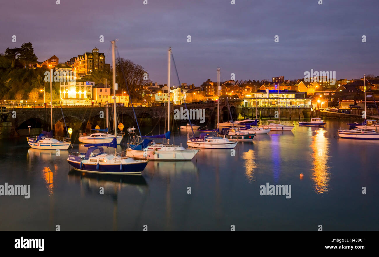 Folkestone Harbour on the Kent coast illuminated at dusk. Stock Photo