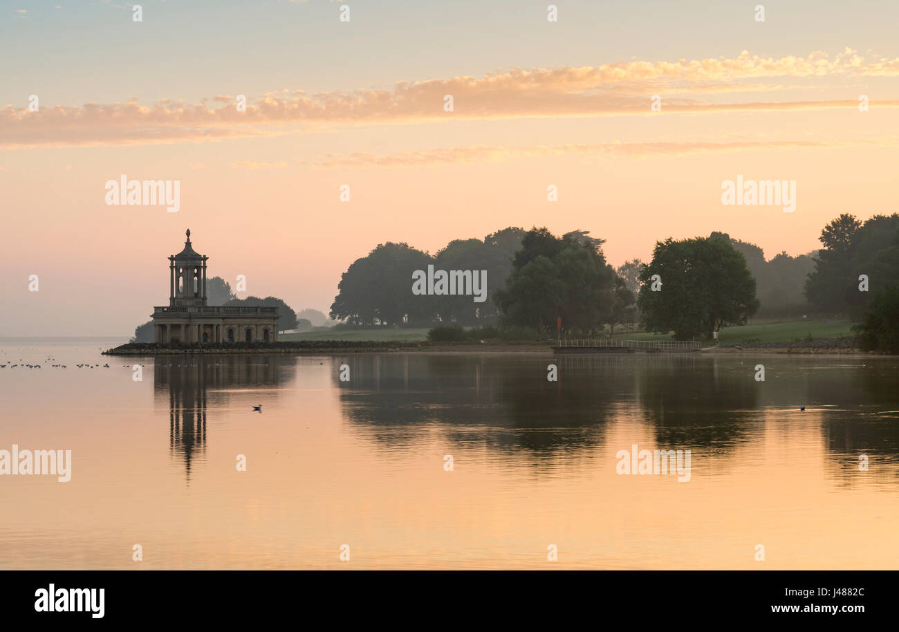 Normanton Church at Rutland Water on a calm Summer's dawn. Stock Photo
