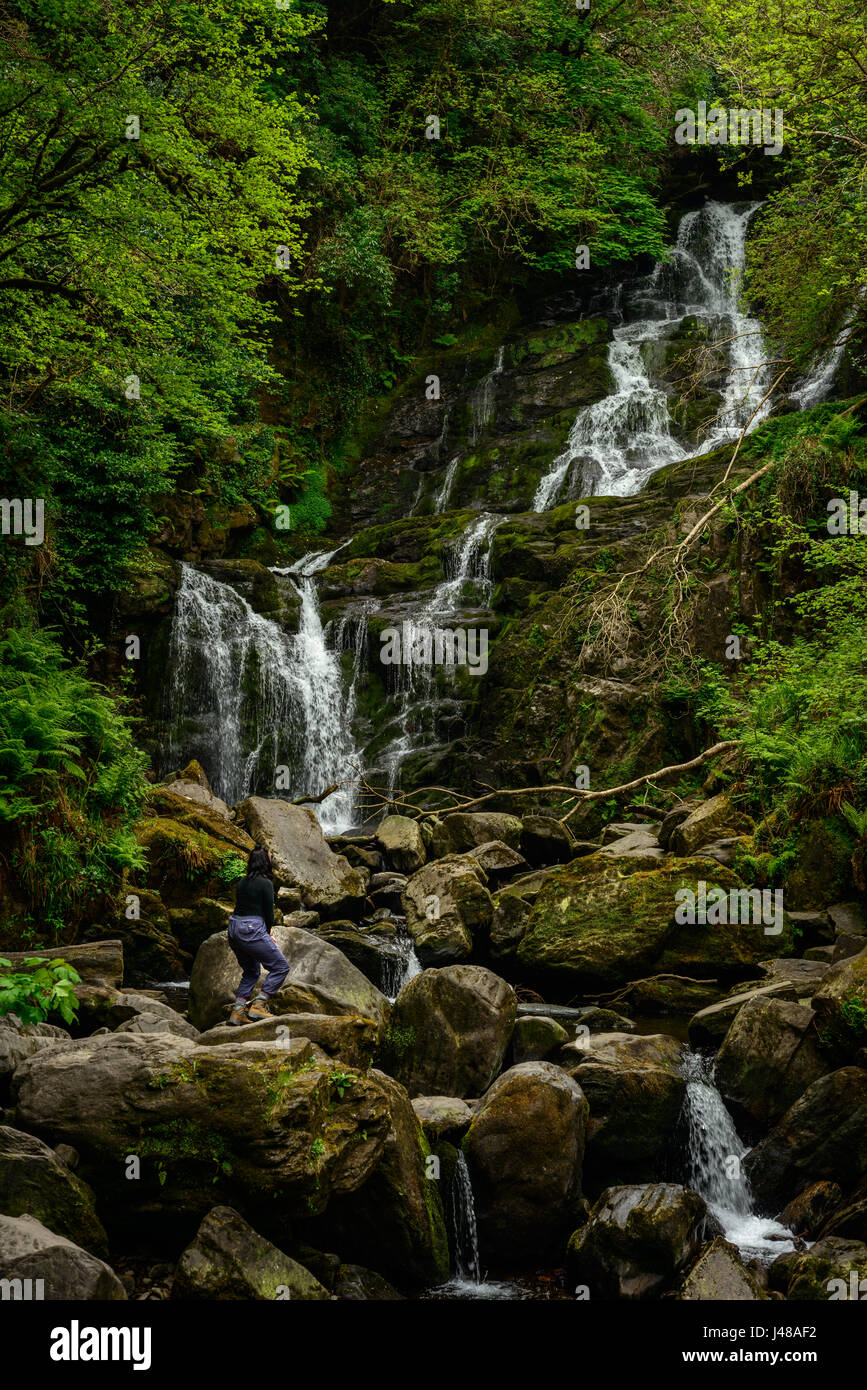 Tourist At Torc Waterfall In Killarney National Park Kerry Ireland