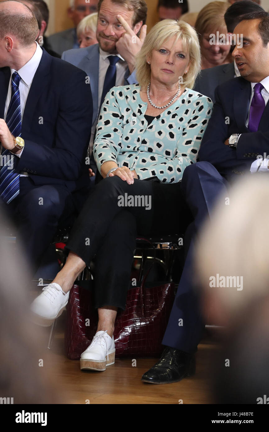 Conservative politician Anna Soubry looks on as Prime Minister Theresa May speaks during a visit to the Richard Herrod Centre in Carlton, Nottinghamshire. Stock Photo