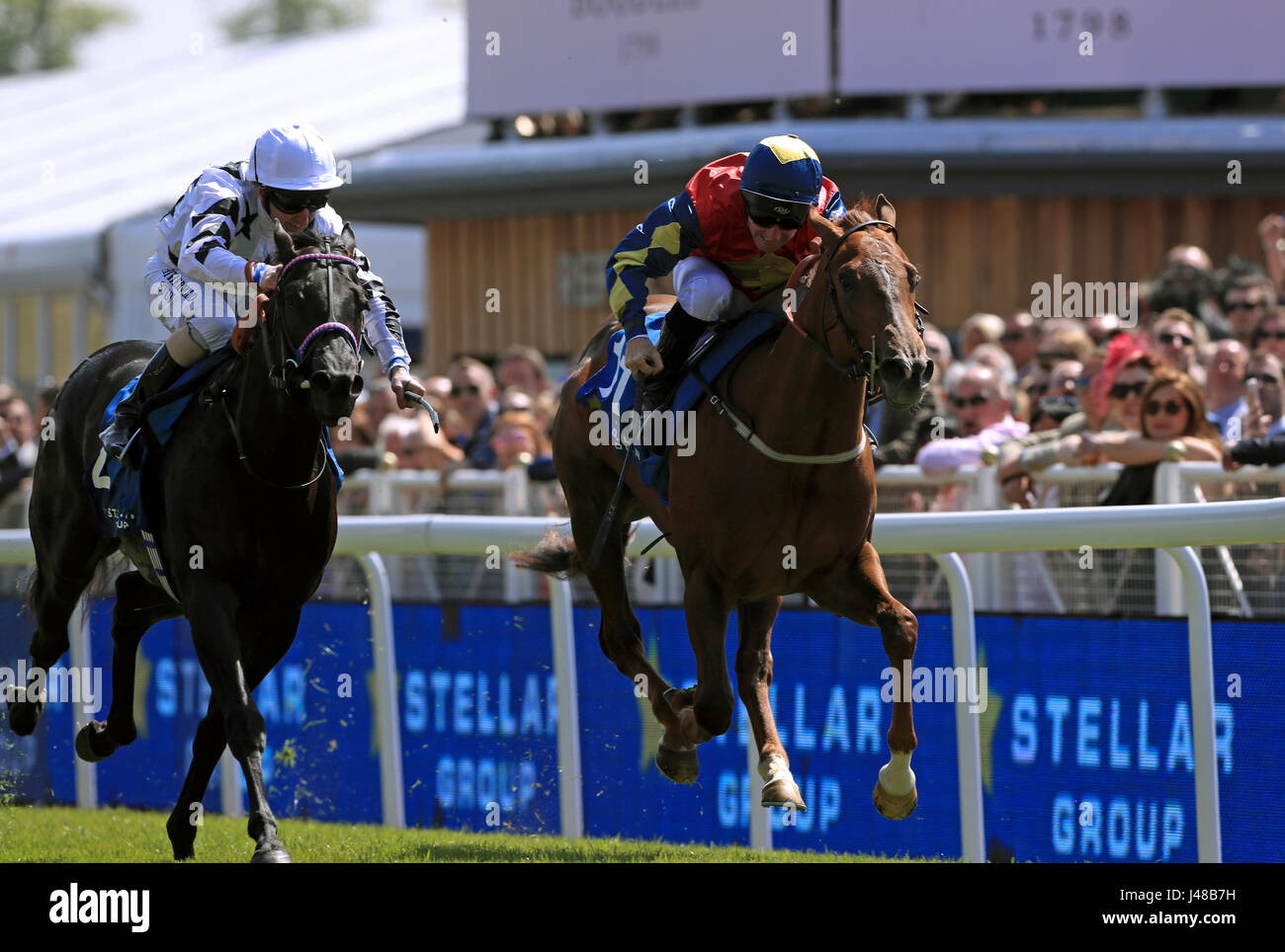 Yogi's Girl ridden by jockey John Egan (right) on the way to winning the Stellar Group Lily Agnes Conditions Stakes during day one of the Chester May Festival. Stock Photo