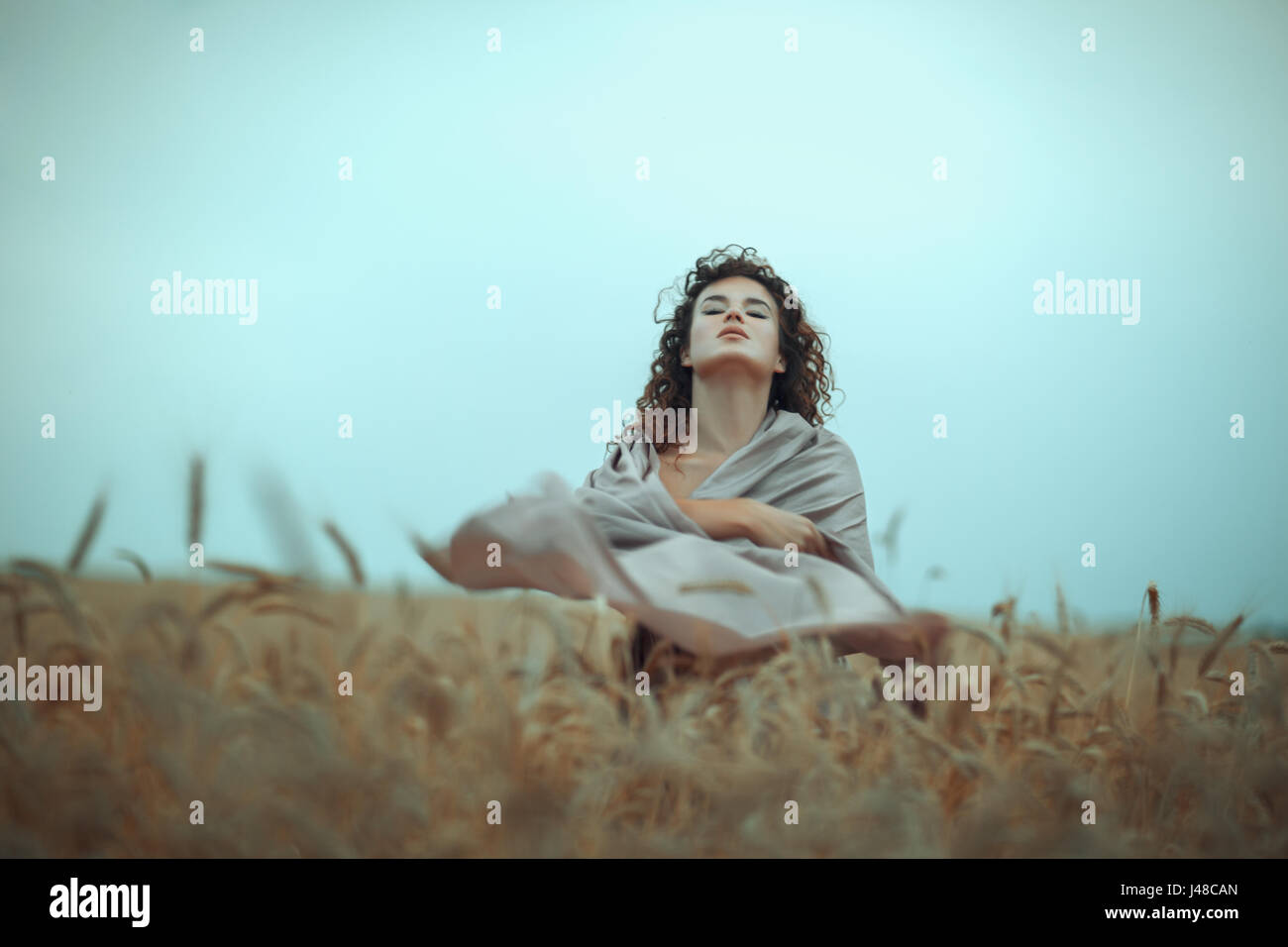 Portrait of a girl in a wheat field Stock Photo - Alamy