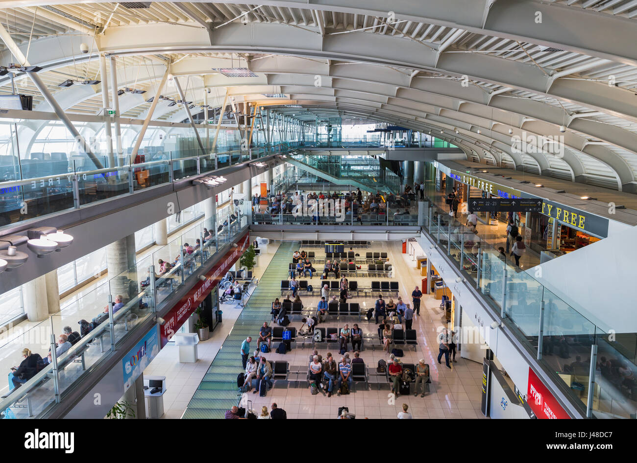 Multiple image panorama of Dubrovnik's modern airport terminal full of passenger awaiting their flights home from the Pearl of the Adriatic. Stock Photo