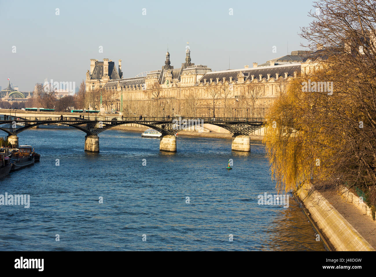 Bridges on the Seine river and passenger ships as a public transport vehicle in Paris. Stock Photo